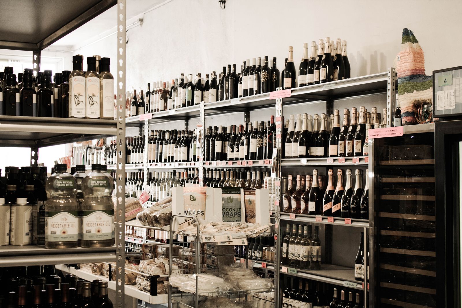 A bright aisle of wine and bottles on the shelves at Berkeley Liquors